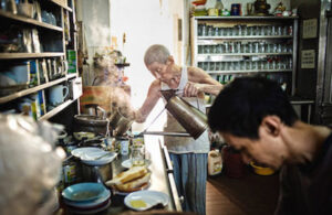 Chinese uncle making coffee